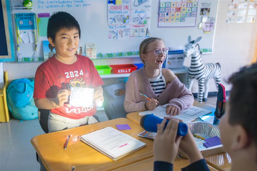 Elementary students doing a light lab